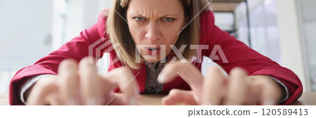 Aggressive worker stretches out hands typing on keyboard 120589413