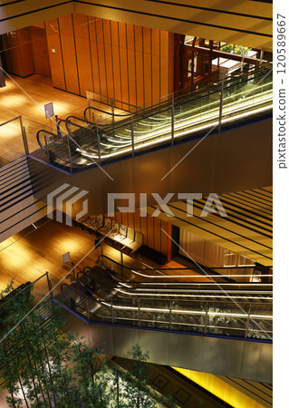 The gold and silver interior decoration of the atrium where the escalators are installed The gold and silver interior decoration of the atrium where the escalators are installed 120589667