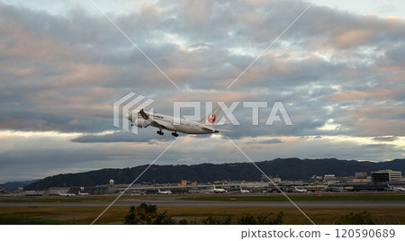 Scene of an airplane taking off from an airport Scene of an airplane taking off from an airport 120590689