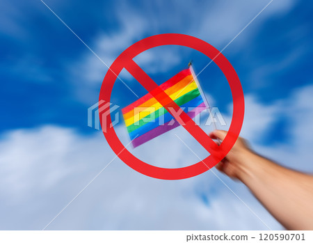 LGBTQ flag held against a blue sky with a prohibition sign with motion blur effect LGBTQ flag held against a blue sky with a prohibition sign with motion blur effect 120590701