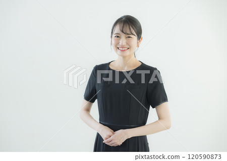 A woman in a black one-piece uniform A woman in a black one-piece uniform 120590873