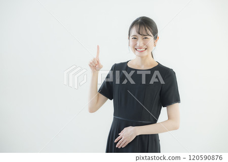 A woman in a black one-piece uniform A woman in a black one-piece uniform 120590876