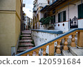 A beautifully constructed set of stairs leading up to a tall building 120591684