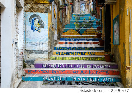 A vibrant set of colorful stairs decorated with welcoming street arts 120591687