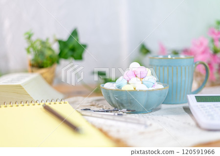 Colorful Ramune and coffee cups prepared on a table with study materials 120591966