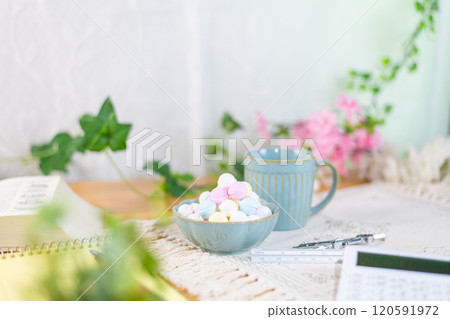 Coffee and a mountain of Ramune are prepared along with study materials. 120591972