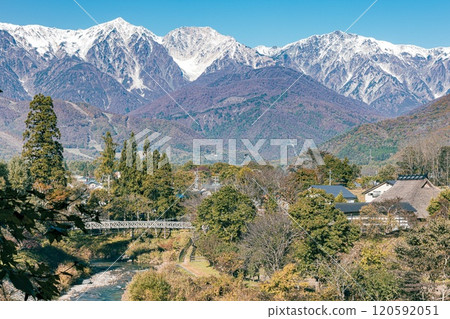 View of autumn leaves and the Northern Alps from the observation deck at Oide Park in Hakuba Village, Nagano Prefecture 120592051