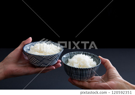 Close-up of a couple holding rice: Image of Japanese food Close-up of a couple holding rice: Image of Japanese food 120592351