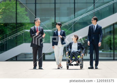 Business wheelchair team walking Business wheelchair team walking 120593375