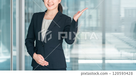 A young Asian businesswoman giving guidance, introduction, recommendation and suggestion A young Asian businesswoman giving guidance, introduction, recommendation and suggestion 120593428