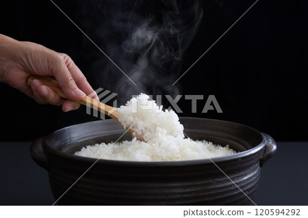 Cooking rice in a clay pot Cooking rice in a clay pot 120594292