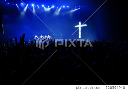 people silhouette with raised hands at christian concert worship God and Jesus Christ, on blue background. Christian concept 120594940