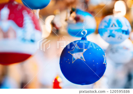 Close-Up of Blue Christmas Ornament with Star Design 120595886