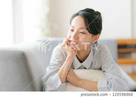 A young woman relaxing on the sofa A young woman relaxing on the sofa 120596868