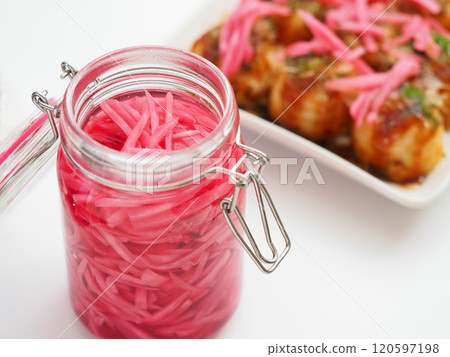 Pickled ginger in a storage jar and takoyaki on a plate Pickled ginger in a storage jar and takoyaki on a plate 120597198