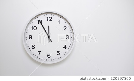 Clean White Clock at 11.55 or 23.55 on Minimalist White Background - Ideal for Time Concepts and Modern Design Clean White Clock at 11.55 or 23.55 on Minimalist White Background - Ideal for Time Concepts and Modern Design 120597560