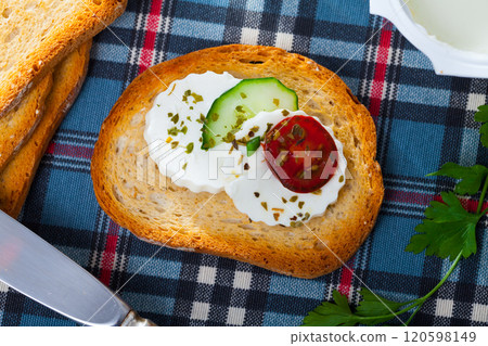 Apetizing canape with young white cheese 120598149