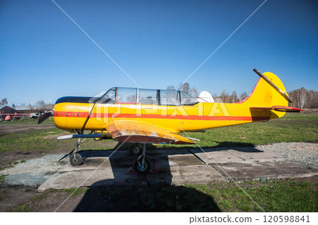 Small sports airplane at the ground airfield 120598841