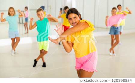 Active children dancing modern dances in choreographic studio Active children dancing modern dances in choreographic studio 120598884