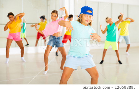 Dance studio - girls and boys in dance lesson 120598893
