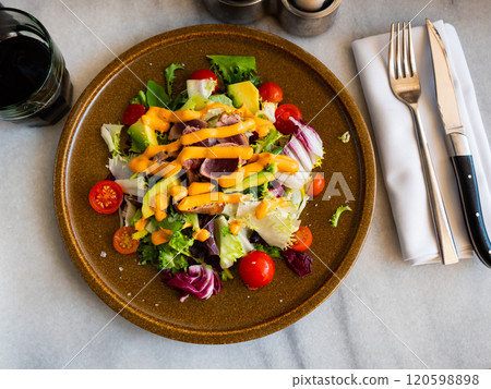 Tuna salad with vegetables and Anticucho sauce 120598898