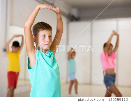 Group children learn dance movements in class Group children learn dance movements in class 120599113