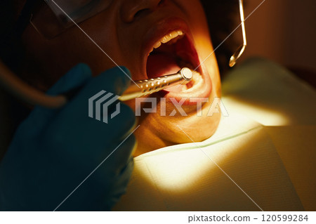 Performing Dental Procedure in Clinical Setting Performing Dental Procedure in Clinical Setting 120599284