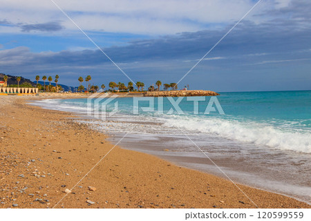 Beach of Mediterranean sea in Menton, French Riviera, France Beach of Mediterranean sea in Menton, French Riviera, France 120599559