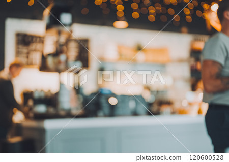 Blurred background material of a cafe with the soft morning sun shining through 120600528