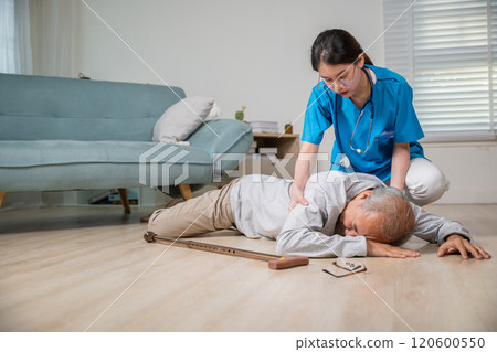 Asian older senior man falling down on lying floor and woman nurse came to help support, Disabled elderly old man patient fall down and caring young assistant at nursing home Asian older senior man falling down on lying floor and woman nurse came to help support, Disabled elderly old man patient fall down and caring young assistant at nursing home 120600550