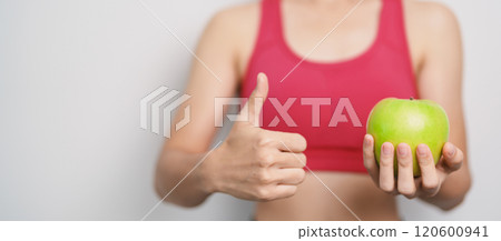 woman hand hold green Apple, happy female fitness choose fruit is Healthy food. Dieting control, Weight loss, Obesity, eating lifestyle and nutrition concepts woman hand hold green Apple, happy female fitness choose fruit is Healthy food. Dieting control, Weight loss, Obesity, eating lifestyle and nutrition concepts 120600941