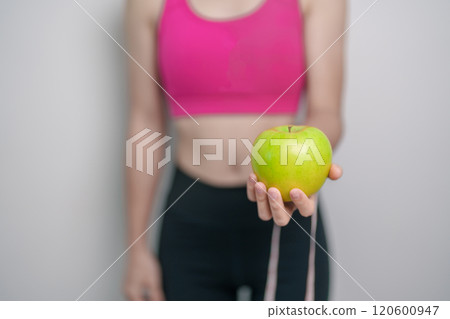 woman hand hold green Apple, happy female fitness choose fruit is Healthy food. Dieting control, Weight loss, Obesity, eating lifestyle and nutrition concepts woman hand hold green Apple, happy female fitness choose fruit is Healthy food. Dieting control, Weight loss, Obesity, eating lifestyle and nutrition concepts 120600947