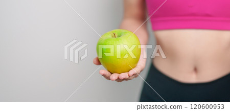 woman hand hold green Apple and donut, female fitness choose between fruit is Healthy and sweet is Unhealthy junk food. Dieting control, Weight loss, Obesity, eating lifestyle and nutrition concept woman hand hold green Apple and donut, female fitness choose between fruit is Healthy and sweet is Unhealthy junk food. Dieting control, Weight loss, Obesity, eating lifestyle and nutrition concept 120600953