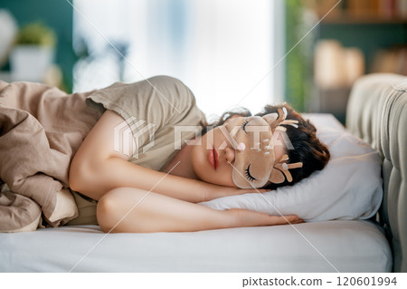 woman is sleeping in the bedroom woman is sleeping in the bedroom 120601994