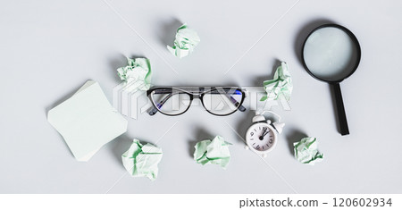 Burnout break concept. Glasses, magnifier and papers on the desk top view web banner 120602934