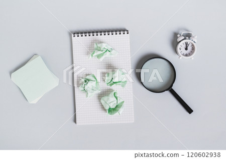 Burnout breaks concept. Crumpled note papers on notebook on light background top view Burnout breaks concept. Crumpled note papers on notebook on light background top view 120602938