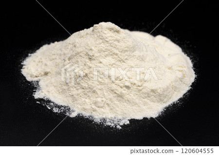 Close-up of protein powder on a black background Close-up of protein powder on a black background 120604555
