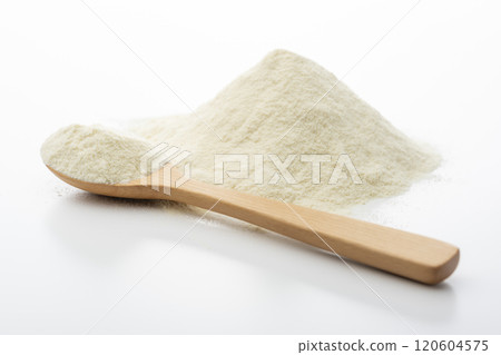 Protein powder in a wooden spoon on a white background Protein powder in a wooden spoon on a white background 120604575