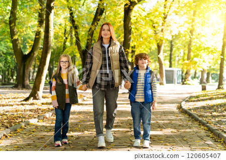 Children walking outdoors in social gathering in park enjoying free time together with fun Children walking outdoors in social gathering in park enjoying free time together with fun 120605407