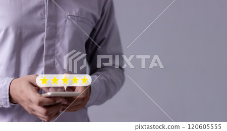 Consumer Satisfaction, Review, Young Man hand uses smartphone mobile with five star to review Consumer Satisfaction, Review, Young Man hand uses smartphone mobile with five star to review 120605555