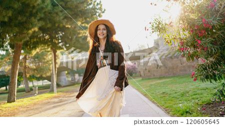 An Elegant Woman in Nature Dressed in a Beautiful Bohemian Style Outfit and Attire 120605645