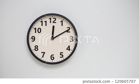 Classic Black-Edged Clock on White Background at 12.10/00.10 - Perfect for Time Management and Text Space 120605787