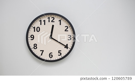 Classic Black-Edged Clock on White Background at 12.20/00.20 - Perfect for Time Management and Text Space 120605789