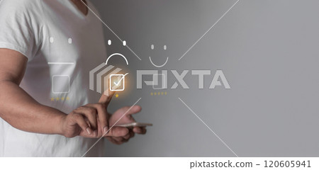 Young man uses smartphone mobile hand touching emoji to review and gives 1 star Young man uses smartphone mobile hand touching emoji to review and gives 1 star 120605941