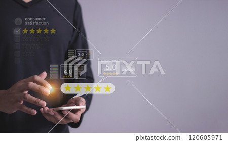 Consumer Satisfaction, Young Man hand uses smartphone mobile with five star 120605971