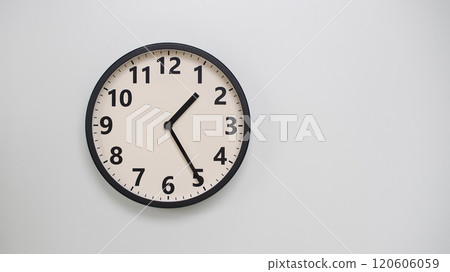 Classic Black-Edged Clock on White Background at 13.25/01.25 - Perfect for Time Management and Text Space 120606059