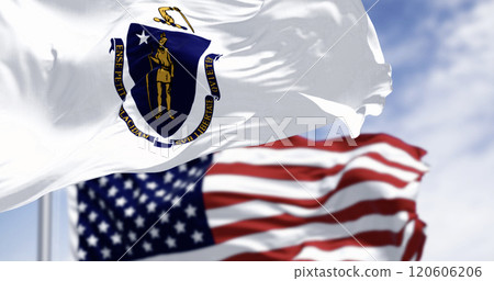 The flags of Massachusetts and the United States waving in the wind on a clear day 120606206