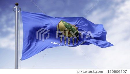 The Oklahoma state flag waving on a clear day The Oklahoma state flag waving on a clear day 120606207