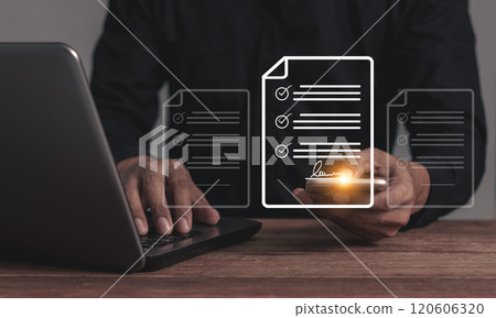 Young man with laptop hand touching smartphone musinessobile to sign a business contract online Young man with laptop hand touching smartphone musinessobile to sign a business contract online 120606320