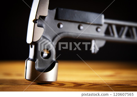 A detailed view of a modern hammer tool that showcases its exceptional design and fine craftsmanship beautifully, close-up 120607565